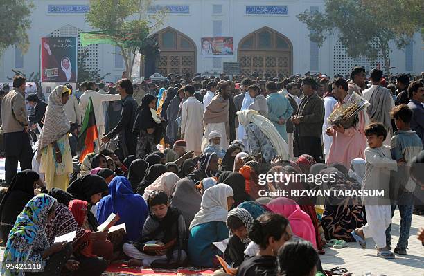 Supporters of slain former premier Benazir Bhutto gather on her second death anniversary in Garhi Khuda Bakhsh on December 27, 2009. More than 5,000...