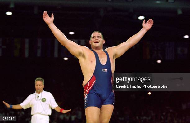 Rulon Gardner of USA celebrates winning the gold medal by defeating Alexandre Kareline of Russia in the 130kg Greco-Roman Wrestling event at the...