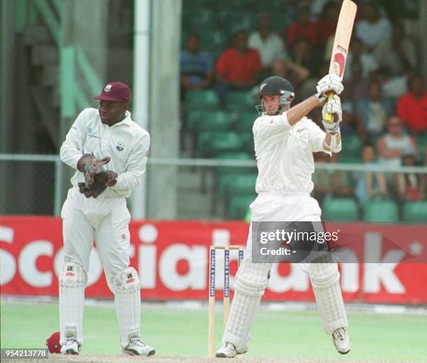 New Zealand bowler Robert Hart cuts against West Indies Carl Hooper for four at Kensington Oval, Bridgetown, Barbados, 23 June 2002. New Zealand...