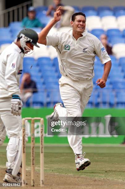 New Zealand bowler Daryl Tuffey celebrates taking the wicket of Pakistani batsman Saleem Elahi on the first day of the first Test Match being played...