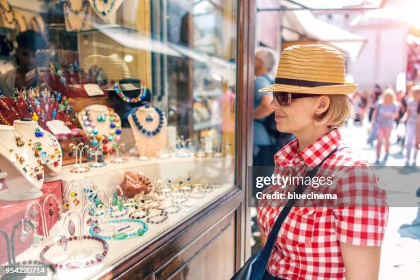 shopping in the street - murano stock pictures, royalty-free photos & images