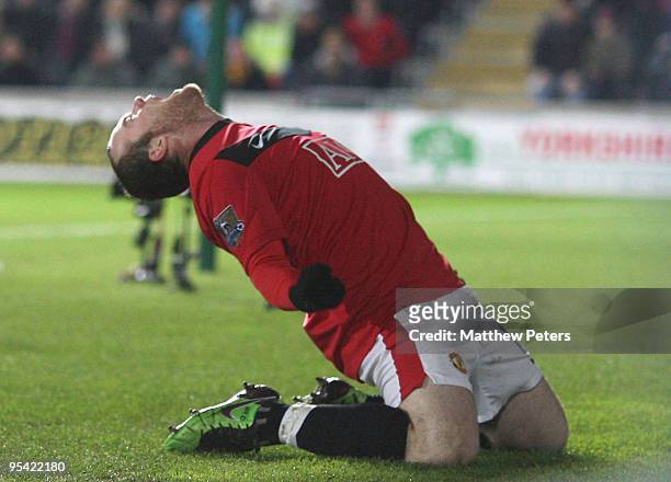 Wayne Rooney of Manchester United celebrates his part in Andy Dawson of Hull City scoring an own-goal during the FA Barclays Premier League match...
