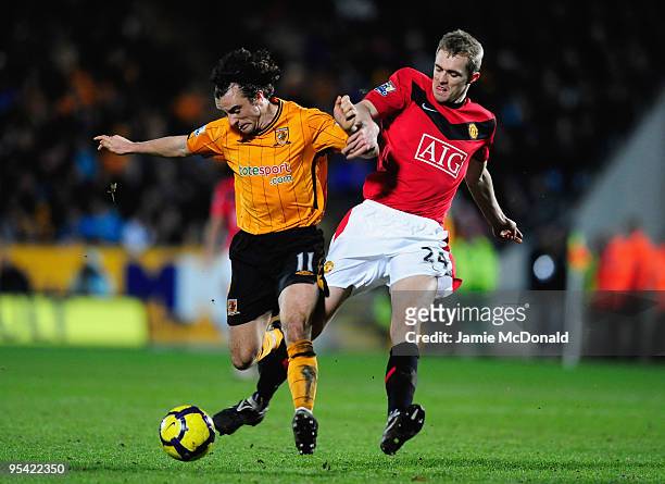 Stephen Hunt of Hull City battles for the ball with Darren Fletcher of Manchester United during the Barclays Premier League match between Hull City...