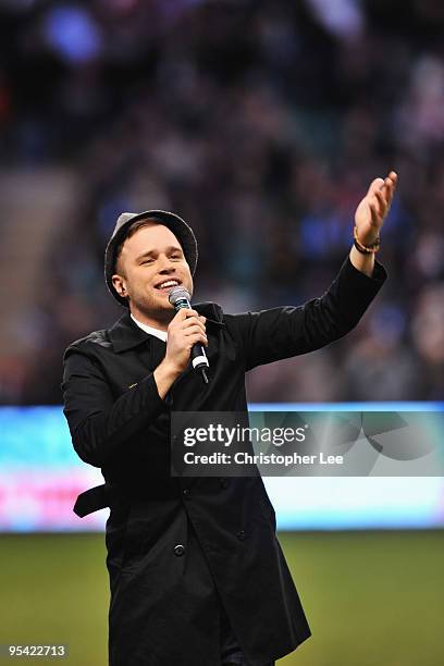 Factor runner up Olly Murs sings to the crowd before the Guinness Premiership match between Harlequins and London Wasps at Twickenham Stadium on...