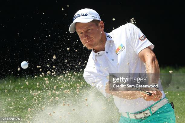 Peter Malnati plays a shot from a bunker on the 15th hole during the first round of the 2018 Wells Fargo Championship at Quail Hollow Club on May 3,...