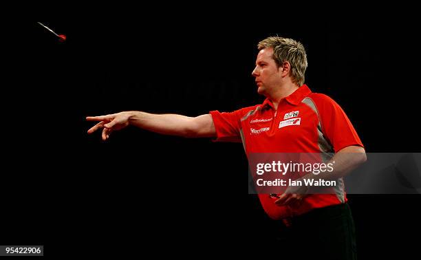 Mark Dudbridge of England in action against Alan Tabern of England during the 2010 Ladbrokes.com World Darts Championship Round One at Alexandra...