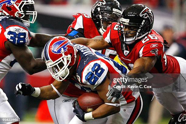 Erik Coleman of the Atlanta Falcons tackles Fred Jackson of the Buffalo Bills at Georgia Dome on December 27, 2009 in Atlanta, Georgia.