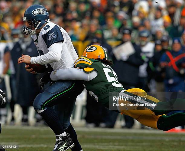 Nick Barnett of the Green Bay Packers sacks Matt Hasselbeck of the Seattle Seahawks at Lambeau Field on December 27, 2009 in Green Bay, Wisconsin.