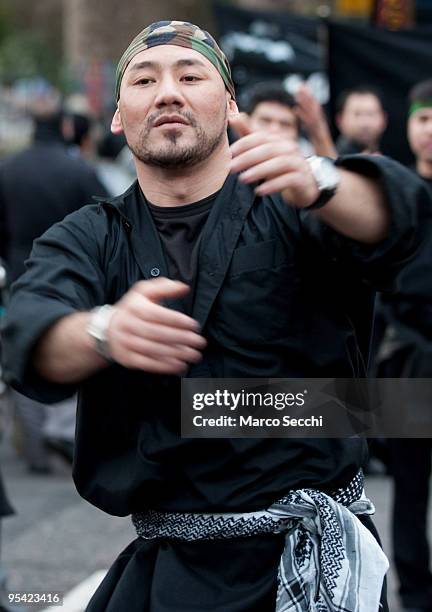 Shiite worshipper beats on his chest during the Ashura procession in Central London on December 27, 2009 in London, England.Ashura is a 10 day period...