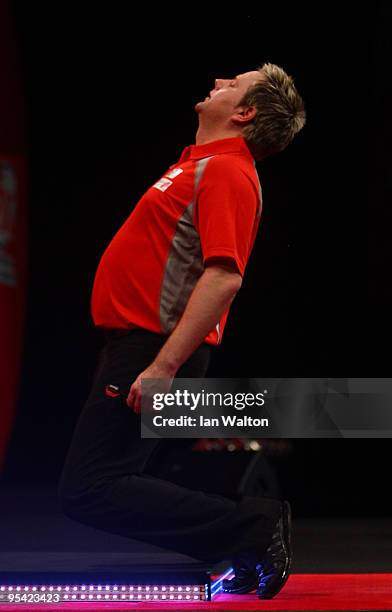 Mark Dudbridge of England celebrates winning against Alan Tabern of England during the 2010 Ladbrokes.com World Darts Championship Round One at...