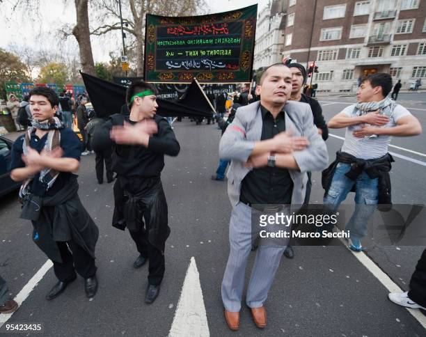 Shiite worshippers beat on their chest during the Ashura procession in Central London on December 27, 2009 in London, England.Ashura is a 10 day...