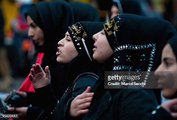 Shiite worshippers beat on their chest during the Ashura procession in Central London on December 27, 2009 in London, England. Ashura is a 10 day...