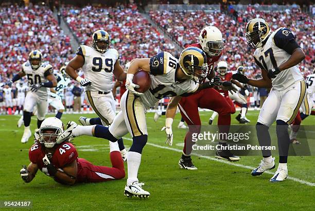 Wide receiver Danny Amendola of the St. Louis Rams runs with the ball after a reception past Rashad Johnson of the Arizona Cardinals during the...