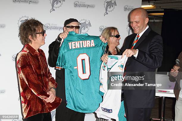 Robin Zander, Tom Petersson, Rick Nielsen and Mike Dee attend the Miami Dolphins game at Landshark Stadium on December 27, 2009 in Miami, Florida.