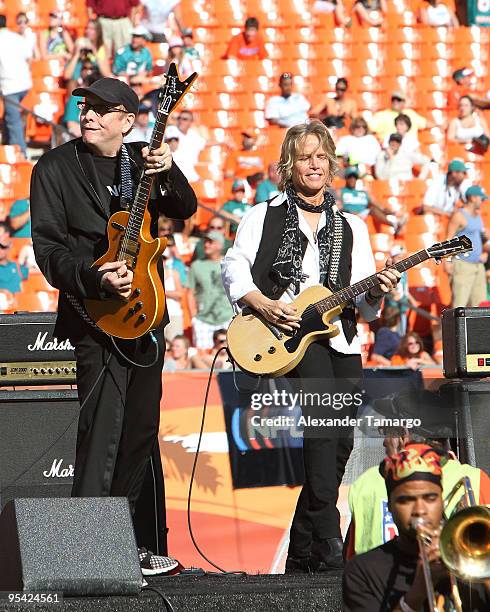 Rick Nielsen and Brian Ray perform at the Miami Dolphins game at Landshark Stadium on December 27, 2009 in Miami, Florida.