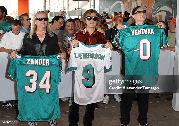 Robin Zander, Tom Petersson and Rick Nielsen attend the Miami Dolphins game at Landshark Stadium on December 27, 2009 in Miami, Florida.