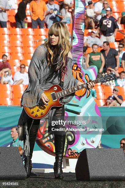 Robin Zander, Tom Petersson and Rick Nielsen performs at the Miami Dolphins game at Landshark Stadium on December 27, 2009 in Miami, Florida.
