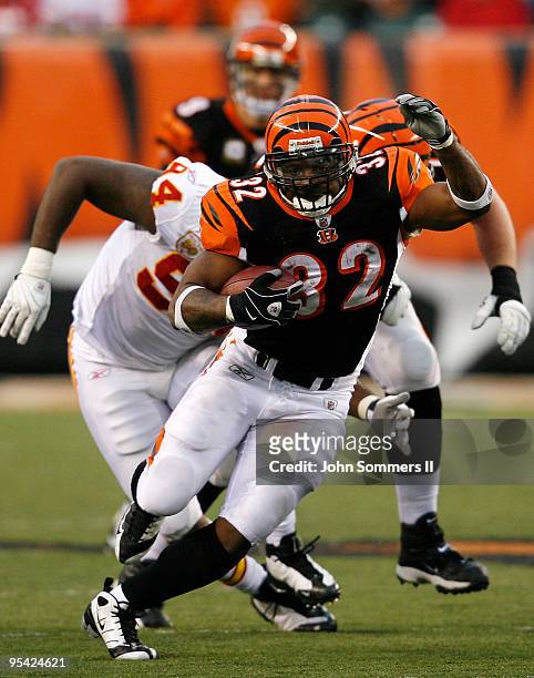 Cedric Benson of the Cincinnati Bengals breaks free from Tyson Jackson of the Kansas City Chiefs in their NFL game at Paul Brown Stadium December 27,...