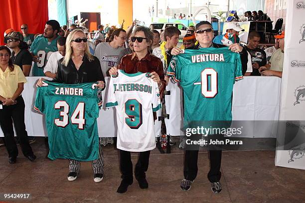 Robin Zander, Tom Petersson and Rick Nielsen attends the Miami Dolphins game at Landshark Stadium on December 27, 2009 in Miami, Florida.