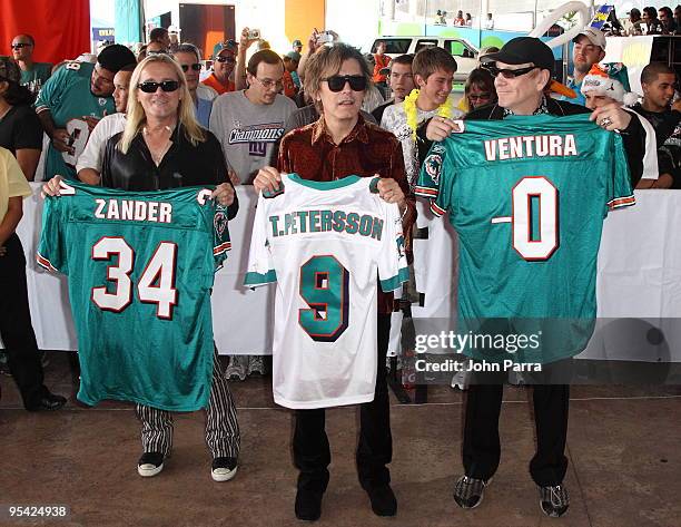 Robin Zander, Tom Petersson and Rick Nielsen attends the Miami Dolphins game at Landshark Stadium on December 27, 2009 in Miami, Florida.