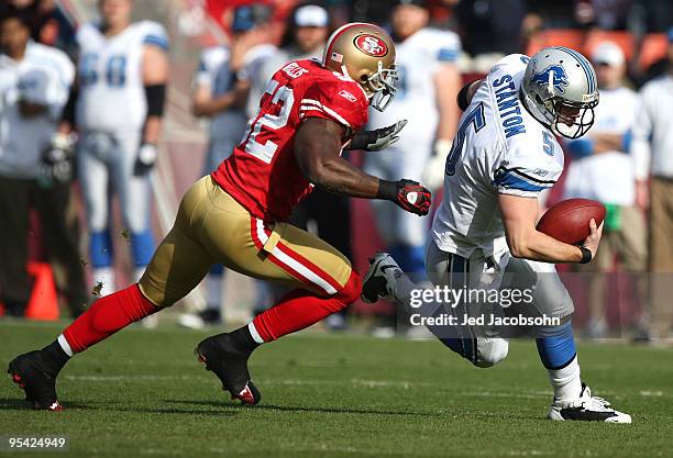 Patrick Willis of the San Francisco 49ers chases quarterback Drew Stanton of the Detroit Lions during an NFL game at Candlestick Park on December 27,...