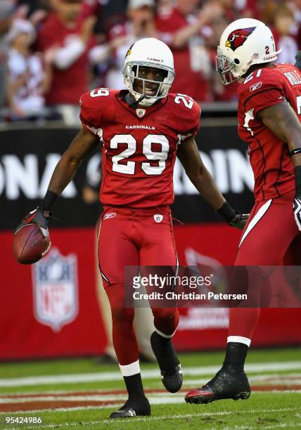 Cornerback Dominique Rodgers-Cromartie of the Arizona Cardinals celebrates with teammate Antrel Rolle after a interception against the St. Louis Rams...