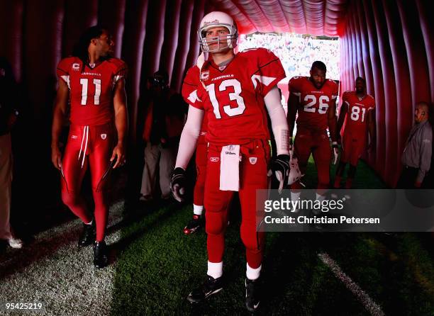 Larry Fitzgerald, Kurt Warner, Beanie Wells and Anquan Boldin of the Arizona Cardinals prepare to take the field before the NFL game against the St....