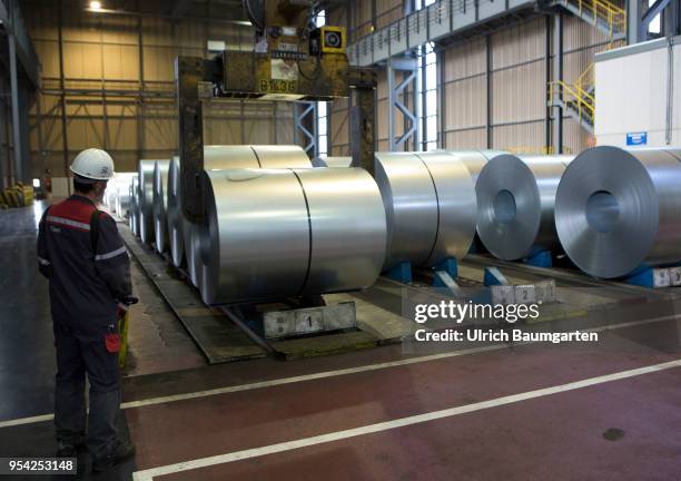 Steel production at ThyssenKrupp in Duisburg. The picture shows a worker during transport of a steel roll in a storage hall for cold-rolled sheet.