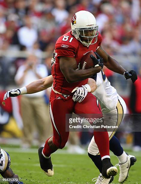 Wide receiver Anquan Boldin of the Arizona Cardinals rushes the football against the St. Louis Rams during the NFL game at the Universtity of Phoenix...