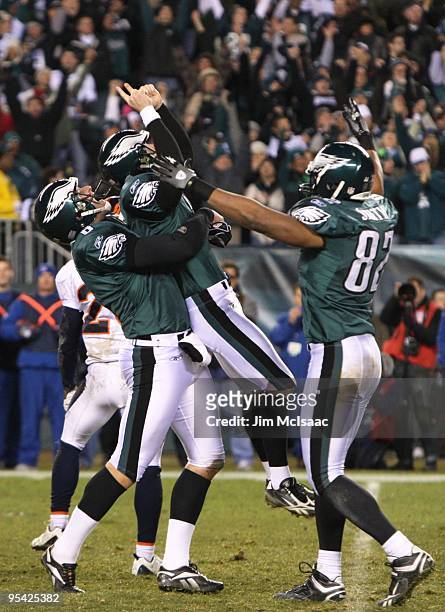 David Akers of the Philadelphia Eagles gets lifted by teammate Sav Rocca after kicking the game winning field goal against the Denver Broncos at...