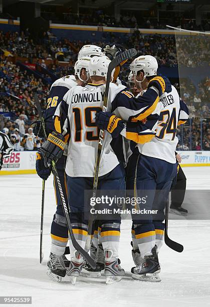 Tim Connolly of the Buffalo Sabres is congratulated on his game winning goal against the St. Louis Blues on December 27, 2009 at Scottrade Center in...
