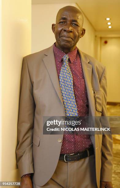 Burundese human rights activists Pierre Claver Mbonimpa poses for the photographer ahead of a ceremony for the joint 'Doctor Honoris Causa' honorary...