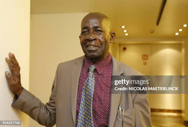 Burundese human rights activists Pierre Claver Mbonimpa poses for the photographer ahead of a ceremony for the joint 'Doctor Honoris Causa' honorary...