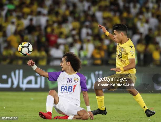 Al-Wasl's Emirati striker Ali Saleh vies for the ball against Al-Ain's Emirati midfielder Omar Abdulrahman during the United Arab Emirates'...