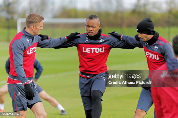 Andy King, Jordan Ayew and Kyle Naughton in action during the Swansea City Training at The Fairwood Training Ground on May 02, 2018 in Swansea, Wales.