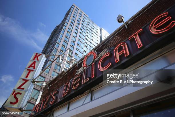 store sign of the famous katz's delicatessen kosher restaurant along houston street in the lower east side of manhattan - east houston street stock pictures, royalty-free photos & images