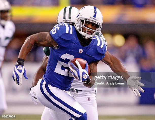 Kelvin Hayden of the Indianapolis Colts runs with the ball after intercepting a pass during the NFL game against the New York Jets at Lucas Oil...