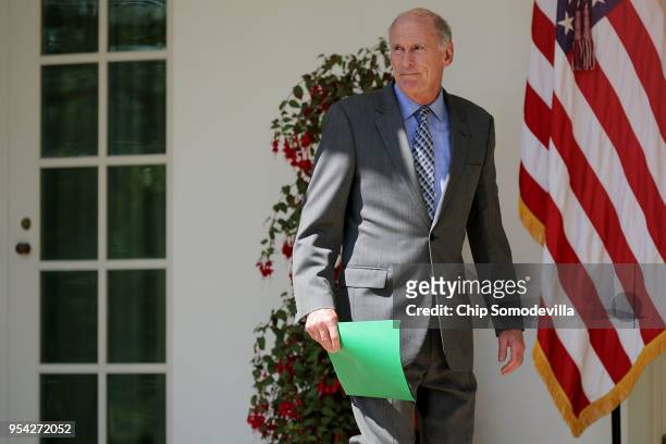 Director of National Intelligence Dan Coats walks along the Rose Garden Colonnade before an event to mark the National Day of Prayer at the White...