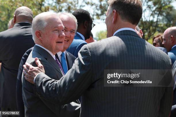 Attorney General Jeff Sessions talks with Interior Secretary Ryan Zinke after an event to mark the National Day of Prayer in the Rose Garden at the...