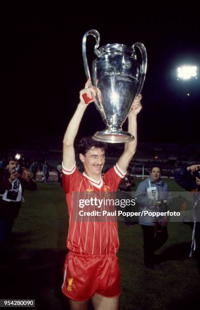 Ian Rush of Liverpool celebrates with the trophy after the European Cup Final between Liverpool and Roma at the Stadio Olympico on May 30, 1984 in...