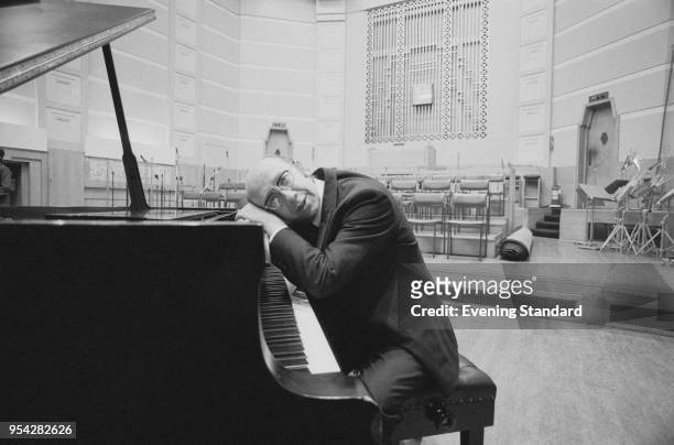 Soviet and Russian conductor Gennady Rozhdestvensky sitting at a piano, UK, 1st November 1977.