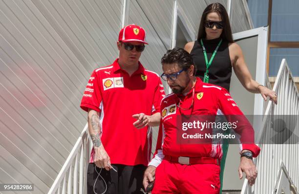Kimi Räikkönen of Finland and Scuderia Ferrari driver and his wife Minttu Virtanen arrive to paddock before practice session at Azerbaijan Formula 1...