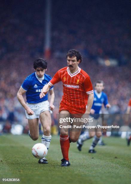 Graeme Souness of Liverpool being chased by Alan Irvine of Everton during the League Cup Final at Wembley Stadium on March 25, 1984 in London,...