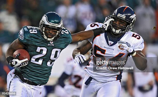 Running back LeSean McCoy of the Philadelphia Eagles stiff-arms defensive end Robert Ayers of the Denver Broncos on December 27, 2009 at Lincoln...