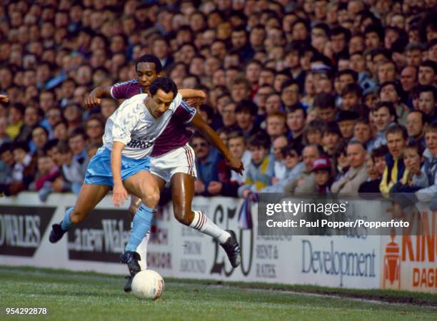 George Parris of West Ham United challenges Ossie Ardiles of Tottenham Hotspur during a Canon League Division One match at Upton Park on March 31,...