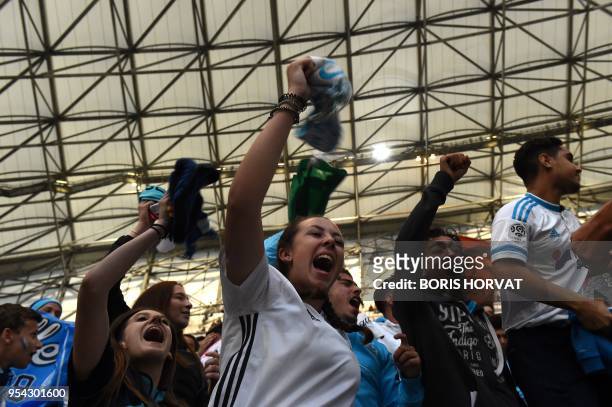 Olympique de Marseille fans cheer before watching the Europa League semi-final football match Salzburg against Marseille on May 3, 2018 at the...