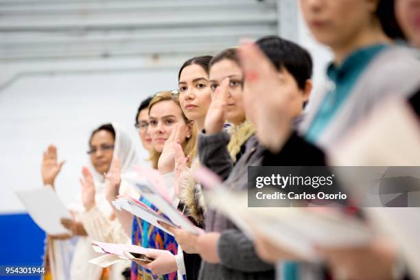 Nazanin Amin , from Iran, takes the oath of citizenship during a citizenship ceremony held at the Royal Canadian Navy local reserve division HMCS...