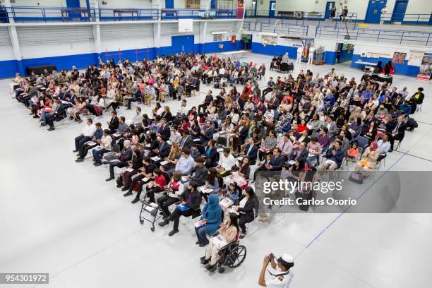 Over 250 people became new Canadians at a citizenship ceremony held at the Royal Canadian Navy local reserve division HMCS York.