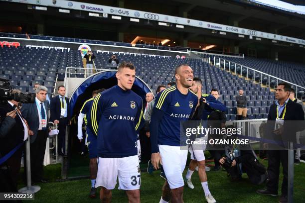 Fenerbahce's players arrive as they wait for the Besiktas team for the rescheduled Turkish Cup semi second leg final football match between...