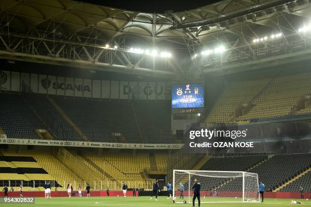 Fenerbahce's players warm up prior to the rescheduled Turkish Cup semi second leg final football match between Fenerbahce and Besiktas on May 3, 2018...